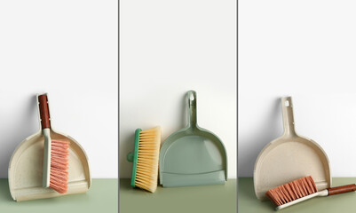 Wall Mural - Set of dustpans and cleaning brushes on floor near light wall