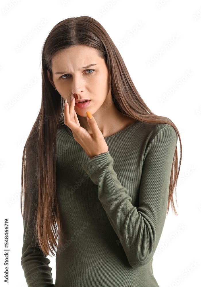 Young pregnant woman with nosebleed on white background
