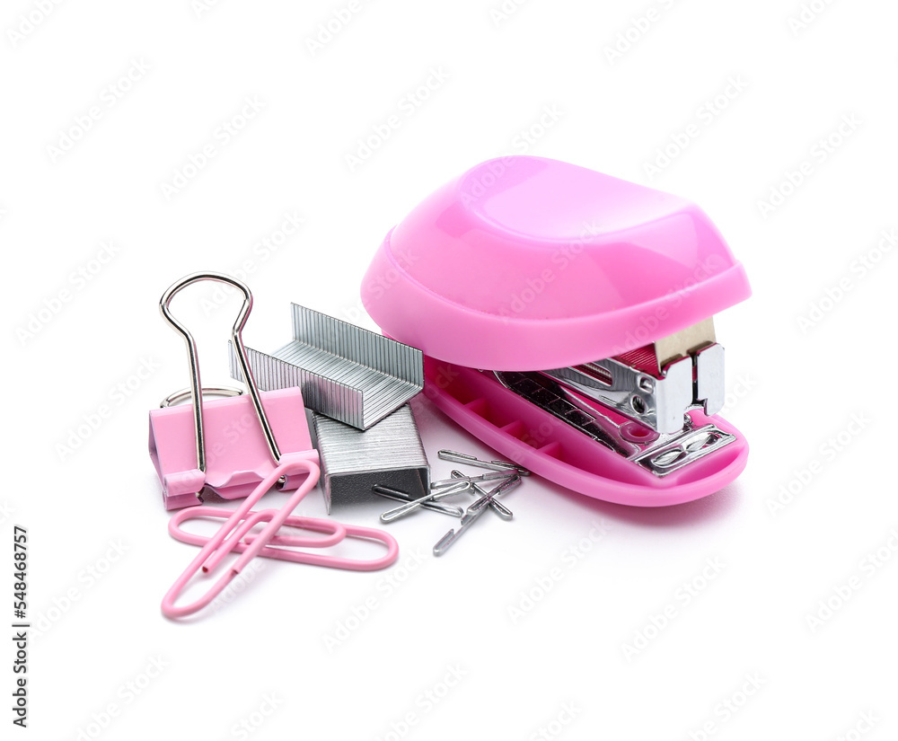 Office stapler, staples and paper clips on white background