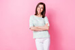 Photo of good mood adorable sweet girl with bob hairdo wear striped t-shirt white pants arms folded isolated on pink color background