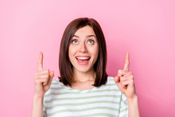 Canvas Print - Portrait of positive cheerful girl with bob hairdo wear striped t-shirt directing look empty space sale isolated on pink color background