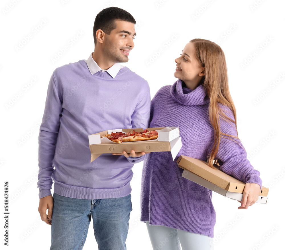 Happy young couple with fresh pizza on white background