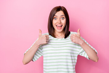 Sticker - Photo of nice cute ecstatic girl with bob hairdo dressed striped t-shirt showing thumbs up approve isolated on pink color background