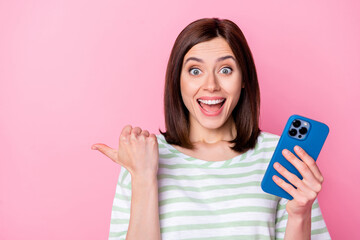 Sticker - Close up photo of astonished lady impressed low price device shop hand direct empty space isolated on pink color background