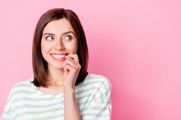 Sticker - Close up photo of sweet cute lady bite fingernaills look empty space imagine date boyfriend isolated on pink color background