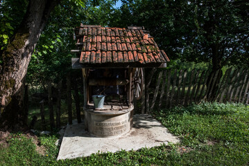 Wall Mural - the fountain with the rustic wheel on Sabeului hill 8