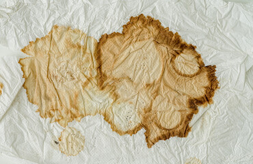 Wall Mural - Texture of a paper towel, with coffee stain