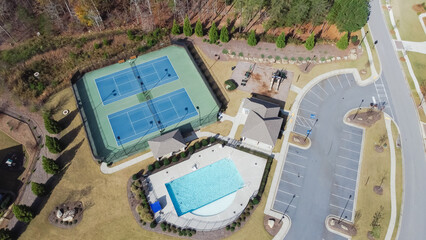 Wall Mural - Large parking space in community recreational area with two tennis court and swimming pool of upscale neighborhood suburbs Atlanta, Georgia, USA