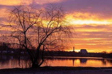 Sticker - Beautiful shot of the sunset over a small lake in the countryside