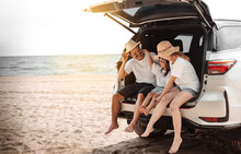 Family With Car Travel Driving Road Trip Summer Vacation In Car In The Sunset, Dad, Mom And Daughter Happy Traveling Enjoy Holidays And Relaxation Together Get The Atmosphere And Go To Destination
