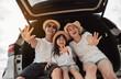 © Kiattisak - Family with Car travel driving road trip summer vacation in car in the sunset, Dad, mom and daughter happy traveling enjoy holidays and relaxation together get the atmosphere and go to destination