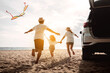 © Kiattisak - Happy Family with car travel road trip. summer vacation in car in the sunset, Dad, mom and daughter happy traveling enjoy together driving in holidays, people lifestyle ride by automobile.
