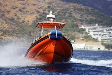 The coast guard boat conducts inspection in the Aegean Sea.