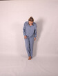 © Шамиль Алиев - Young girl in a homemade suit in the studio on a white background
