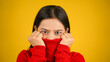 © Arnav Pratap Singh - Young Woman feeling cold isolated over yellow background, Shivering due to cold, beautiful Asian Indian women
