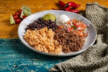 Tasty Barbacoa Burrito Bowl, Meat Rice Black Beans Sour Cream Guacamole And Chopped Vegetables