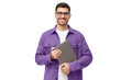 Young smiling modern male teacher holding laptop