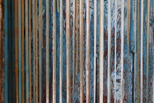Detail Of Old Curtains In Front Of Rustic Wooden Door