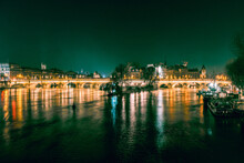Parisian Bridge Over Seine River At Night