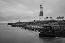 Black And White Photo Of Portland Bill Lighthouse In Dorset At Dusk