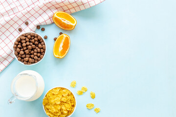 Wall Mural - Healthy corn flakes with fruits for breakfast, top view