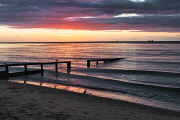 Wall Mural - scenic view of a beach during sunset in shanklin, isle of wight, england, united kingdom