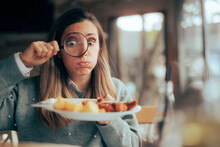 Funny Food Critic Checking The Restaurant Dish With A Magnifying Glass. Picky Eater Analyzing The Ingredients In A Meal Course
