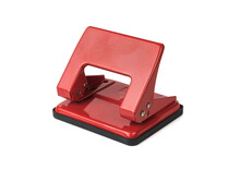 Red metal paper punch isolated on a white background.