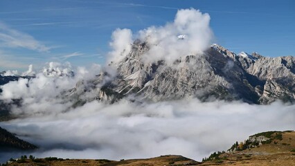 Wall Mural - landscape with clouds over mountains - time lapse video