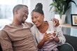 © T Hover/peopleimages.com - Coffee, relax and black couple on sofa in home living room, bonding and talking. Love, tea and romantic man and woman speaking, discussion or conversation on couch in lounge or enjoying time together