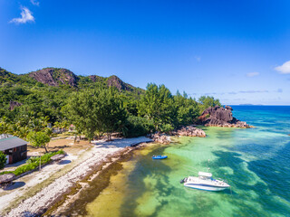 Wall Mural - An aerial view on Anse Papaie near giant tortoise sanctuary on the small Curieuse island, Seychelles