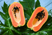 Papaya Fruits On Backgroud, Fresh Ripe Papaya Slice Tropical Fruit With Papaya Seed And Leaf Leaves From Papaya Tree