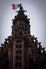 Wall Mural - French flag at the top of Cathedral of Strasbourg in France on November 2022