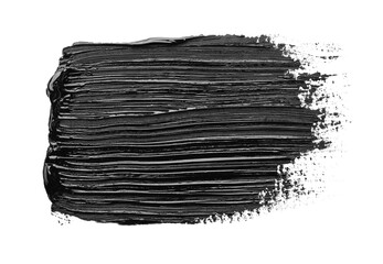 Brushstrokes of black oil paint on white background, top view