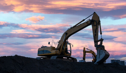 Wall Mural - Excavator in open pit mining. Excavator on earthmoving on sunset. Loader on excavation. Earth-Moving Heavy Equipment. Earth mover ar construction site. Backhoe Loader on Road construction.