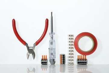 Wall Mural - Different tools for electronics repair laid out on a white background