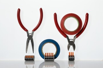 Wall Mural - Different tools for electronics repair laid out on a white background