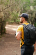 © KRCfotografía - White man hiking through the forest in autumn.