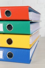 Wall Mural - Stack of office folders on wooden table, closeup