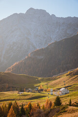 Wall Mural - The mountains of Val Brembana, near the town of San Simone (Italy) with the colors of the golden hour - October 2022.