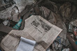 Scraps of old soviet newspapers Inside the destroyed village in the exclusion zone, Pripyat region, Chernobyl disaster