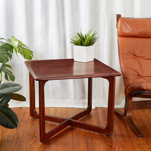 Mid-century Modern Dark Walnut Wood Side Table. Interior Scene With A Designer End Table Next To A Light Leather Vintage Chair With Houseplants To The Side. Better Goods