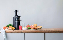 Black Modern Electric Fruit Juicer On The Kitchen Table