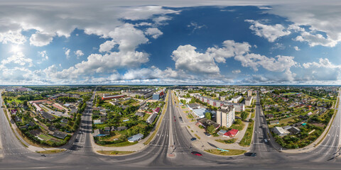 aerial seamless spherical hdri 360 panorama view above road junction with traffic in residential complex with high-rise buildings  with private sector in provincial town in equirectangular projection.