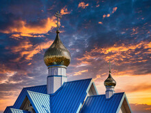 A Partial View Of The Orthodox Church Under The Dramatic Dark Cloudy Sky During Sunset
