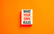 Make your own rules symbol. Concept words Make your own rules on wooden cubes. Beautiful orange table orange background. Business motivational make your own rules concept. Copy space