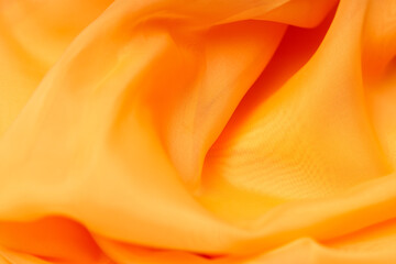 Poster - beautiful orange silk. wavy background fabric