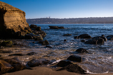 Wall Mural -  2022-11-22 LA JOLLA COVES ROCKY SHORELING WITH LOW TIDE AND LA JOLA SHORES IN THE BACKGROUND