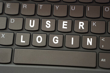 Poster - On the black keyboard, the inscription is highlighted in white - User login