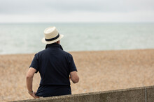 Hastings, United Kingdom, 24, August 2022 An Elderly Man On The Oceanfront With Hat On Looking Out To Sea